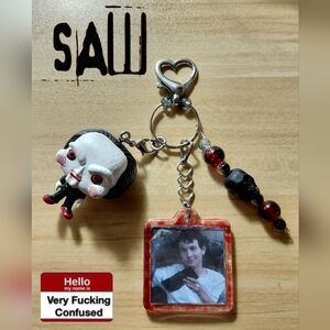 Saw Adam Stanheight Keychain With Baby Billy Funko Pop.